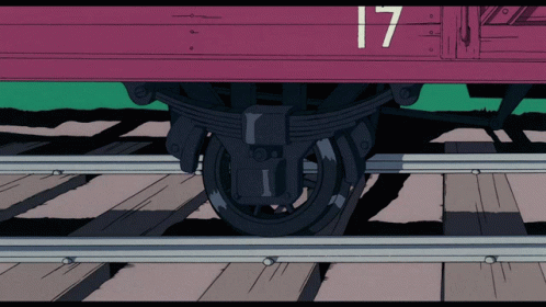a purple train engine car sitting on tracks