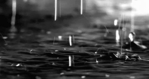 black and white pograph of drops of water falling from the ceiling