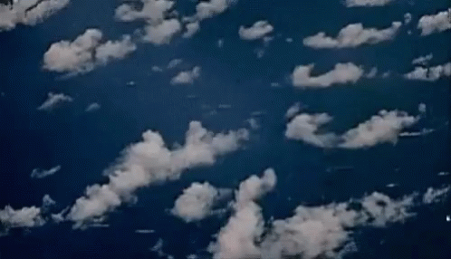 aerial view of brown skies with white clouds