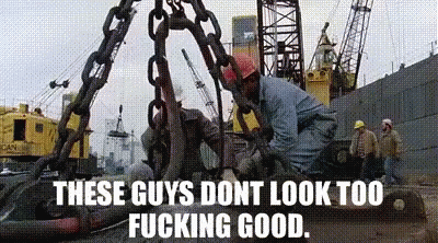 there are men working on a crane