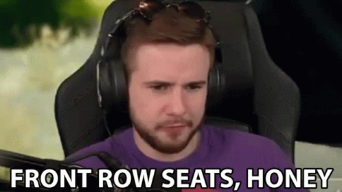 a man with headphones is sitting in a chair