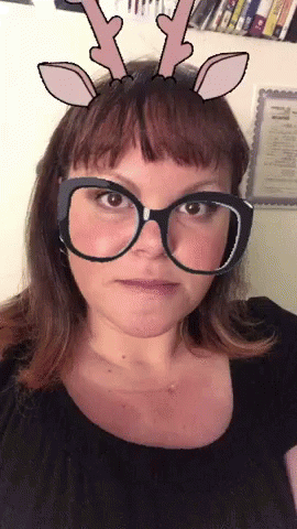 a woman is wearing glasses with an odd nose