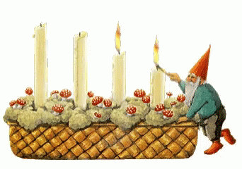 a man kneeling down next to some white candles