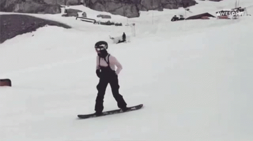 a person on a snow board in the snow