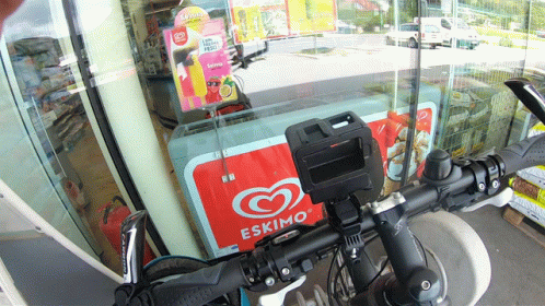 a bicycle parked in front of a display case
