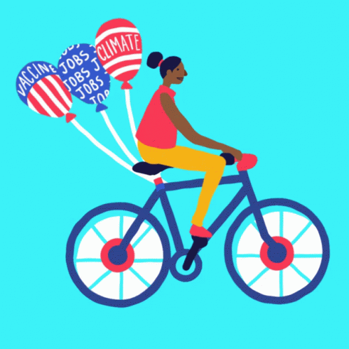 a person is riding on a bicycle with balloons in the shape of an american flag