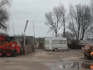 a truck and tractor in a trailer yard