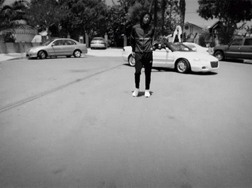 the man is skateboarding down the empty street