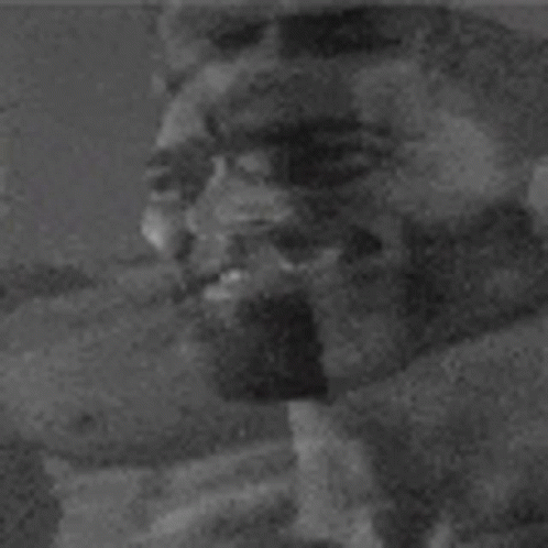 the black and white pograph shows a closeup of someone's face
