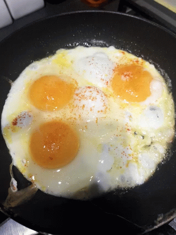 eggs being fried in oil on a set