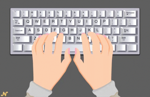 a man's hands typing on a computer keyboard