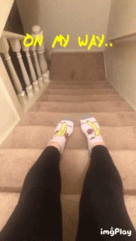 a person is standing on a staircase with their legs crossed