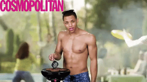 the young man is shirtless and holding an electric grill