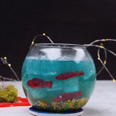 a jar filled with green and blue stuff