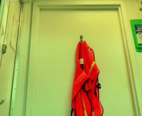 an umbrella is hanging on the door of a locker