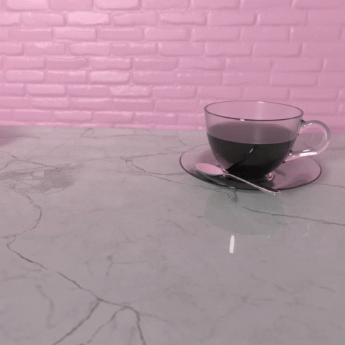 a glass cup sitting on top of a saucer