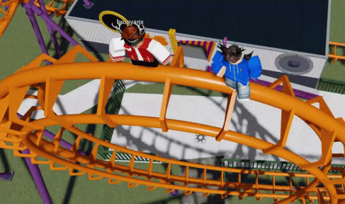 two cats are on a roller coaster for fun