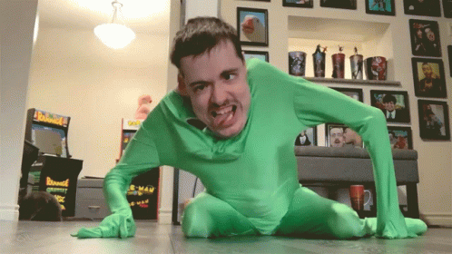 a man dressed in neon green on the floor