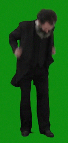 a man standing in front of a green screen