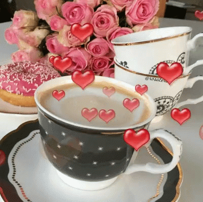 a close up of a cup and saucer on a table