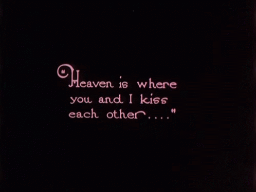 there is a neon sign that says heaven is where you and i kiss each other