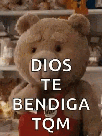 there is a large blue teddy bear that reads dios te benedicte tom