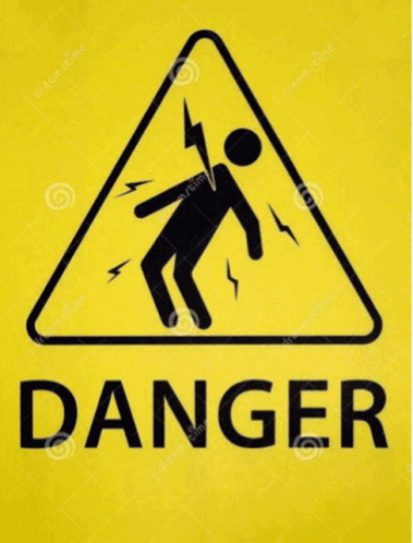 a sign that reads danger with a person standing in the corner
