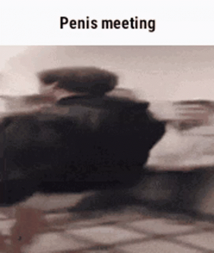 blurry image of a vehicle and person at a meeting