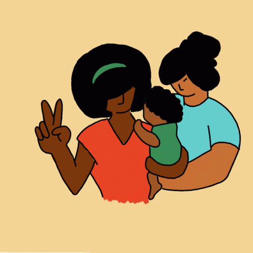 a man is holding a baby and the woman is giving the peace sign