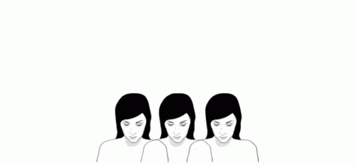 three women are standing with their heads close to each other