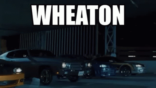 two cars and a large building with the words wheatton on it