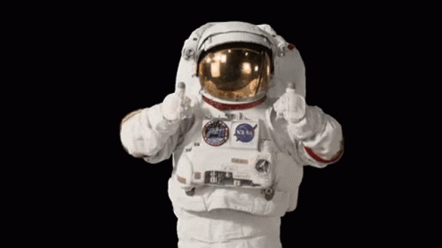 the astronaut in his space suit waving