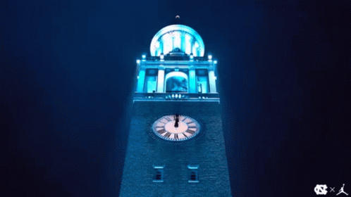 a picture of a clock tower lit up for the night