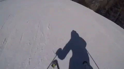 a shadow is cast on the side of a mountain
