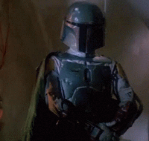 a person dressed as a boba fett standing by some lights