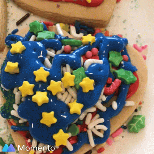 a cookie covered in white icing with different decorations