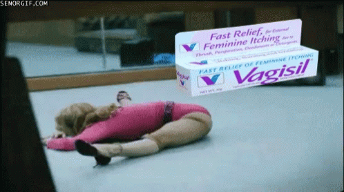 a doll on the ground next to a packaging