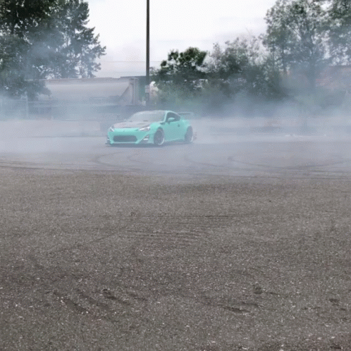 an image of a car in the middle of the road with steam coming out from it