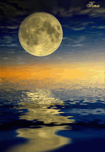 a beautiful picture of the moon over the water