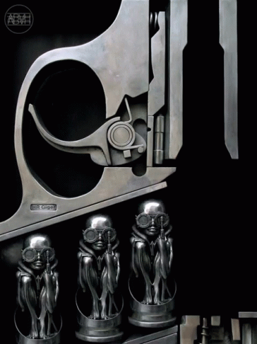 four metal trophies with the shape of a gun sticking out of it