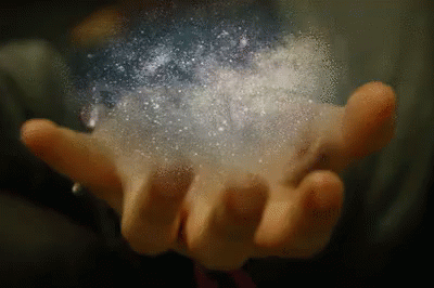 blue gloved hands holding white powder against black background