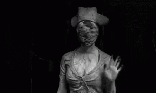 a statue is in the dark with a creepy mask