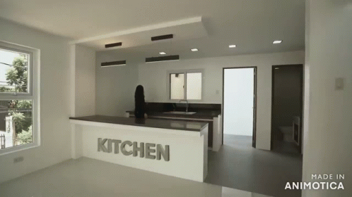 an empty kitchen is shown in an almost white way