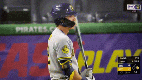 a baseball player holds a bat on a video screen
