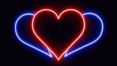 a heart shaped neon frame against a black background