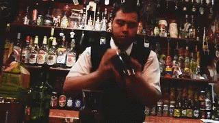 a man is at the bar making his own drink