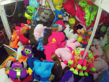 stuffed animals and toys are arranged for sale in a box