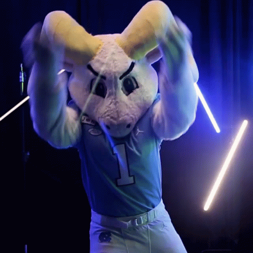 a rabbit mascot holding a microphone in the shape of a football team uniform