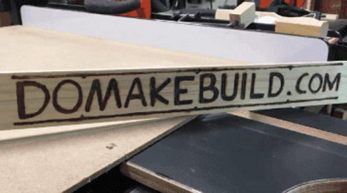 a sign that reads'dominate build com'sits on a table