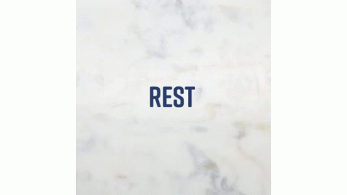 a marble wall with the word rest displayed